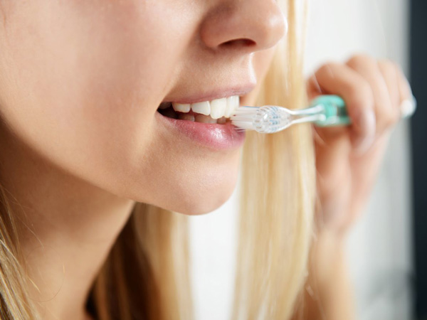 Girl brushing her teeth